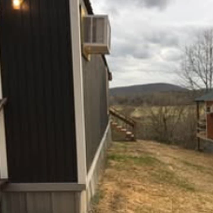 Cabin One exterior on the wooded hillside
